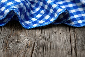 Checkered blue and white tablecloth draped over a rustic wooden table, creating a cozy and inviting scene