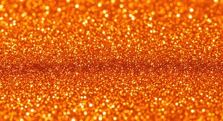 Closeup of shimmering orange glitter particles creating a sparkling textured background