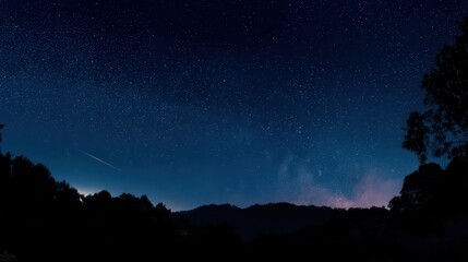 Starry Night Sky Over Silhouetted Mountains
