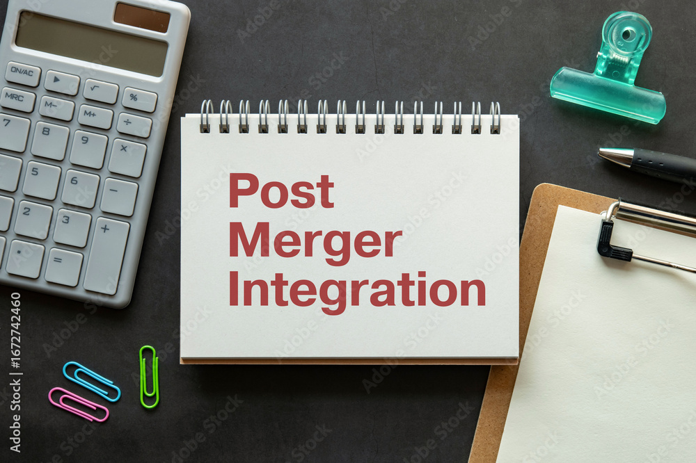 Poster there is notebook with the word post merger integration. it is as an eye-catching image.
