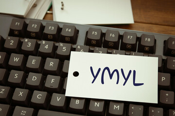 There is word card with the word YMYL. It is an abbreviation for Your Money or Your Life as...