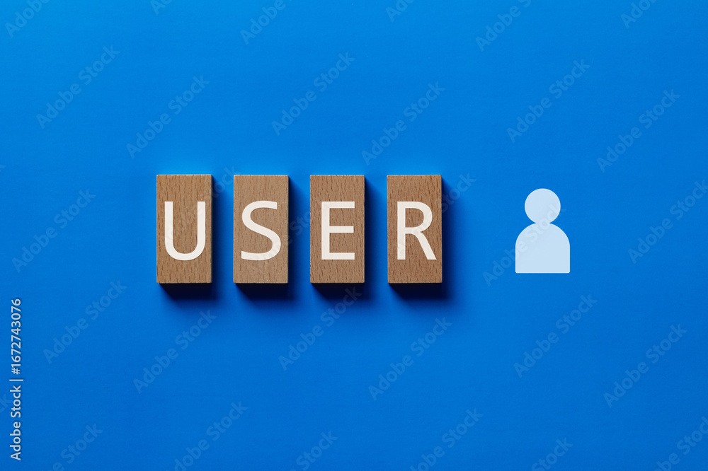 Poster there is wood block with the word user. it is as an eye-catching image.