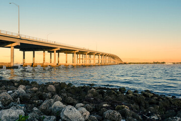 Key Biscayne Bridge at Sunrise or Sunset with Rocky Shoreline and Water