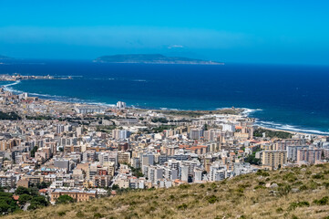 Obraz premium View from heights of Erice to scenic coastal roads, Trapani’s salt pans and olive groves, panoramic view on Trapany and Mediterranean sea, travel destination in Italy