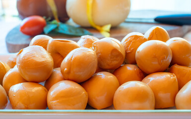 Cheese collection, smoked yellow italian mini scamorza or scamorzella cheese