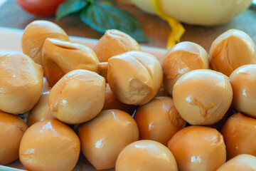Cheese collection, smoked yellow italian mini scamorza or scamorzella cheese
