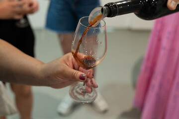 Tasting of Banyuls AOC aged natural sweet grand cru Banyuls fortified dessert wine from old vines from slopes Pyrenees in Roussillon, France made in glass jar Dame Jeanne or demijohn