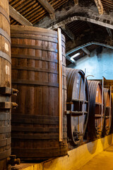 Old oak barrels for aging of natural sweet red grand cru wine Banyuls fortified dessert wine from...