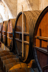 Old oak barrels for aging of natural sweet red grand cru wine Banyuls fortified dessert wine from...