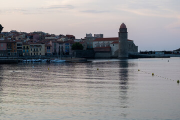 Evening view on sea bay, lights and colourful houses of Collioure, Cote Vermeille,...
