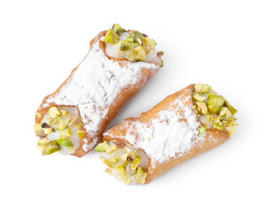 Delicious cannoli with ricotta cheese, pistachios and powdered sugar isolated on white, top view