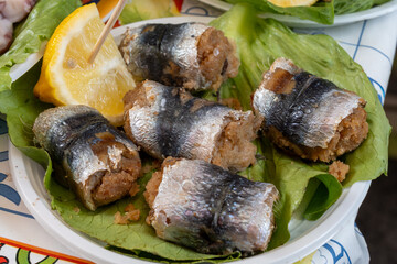 Delicious fresh cooked street food on daily food market in Palermo, Sicily, travel destination, food tourism Italy, variety of roasted, grilled fish, seafood, meat, vegetables served snacks, dish