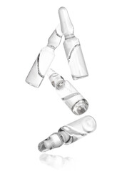 Many glass ampoules falling on white background