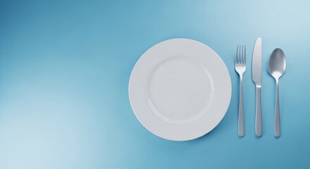 Empty white ceramic plate with metal fork, knife, and spoon arranged on a clean blue background. Restaurant dining setup,advertising banner, poster, flyer with copy space