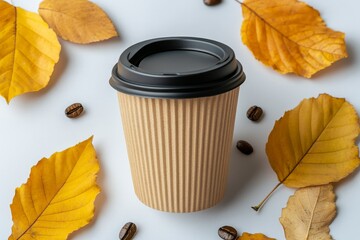 Autumn is showcased through a still life composition of a cup of coffee, autumn flowers, and leaves on a white background, presented in a flat lay and top view with room for copy