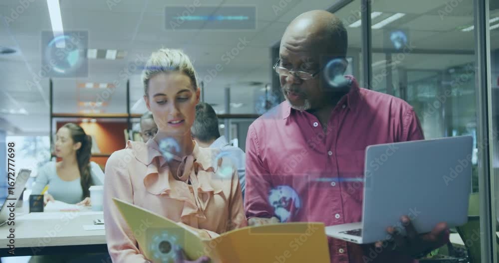 Aufkleber two colleagues opening folder and pointing while animating ui charts and maps for business review