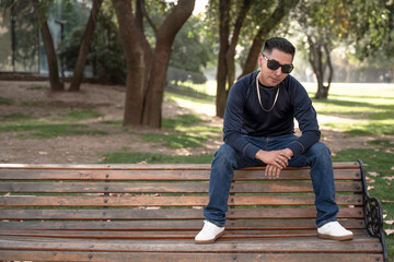 young man sitting on bench