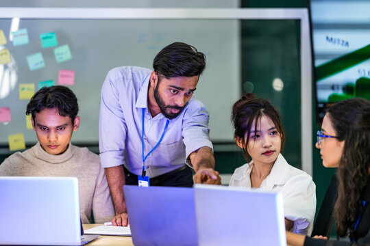 A focused IT specialist uses a security card for system authentication. A concept for cybersecurity, network access control, and technical support in a modern data center.