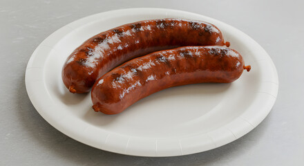 Grilled bratwurst served on a simple paper plate