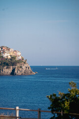 Naklejka premium Vibrant photos of Cinque Terre featuring Italian beaches, boats on the Mediterranean, bikini lifestyle, coastal towns, colorful villages, and summer vacations