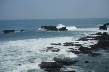waves crashing on rocks
