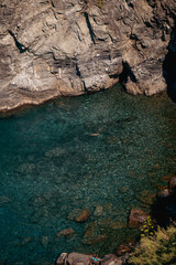 Vibrant photos of Cinque Terre featuring Italian beaches, boats on the Mediterranean, bikini lifestyle, coastal towns, colorful villages, and summer vacations