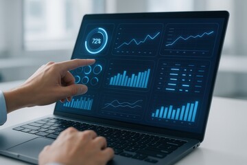 Data Analysis on Display: A person's finger hovers over the laptop's screen showcasing detailed charts and graphs that light up the information.