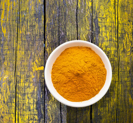 Organic turmeric powder in the bowl - Curcuma longa