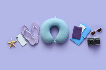 Composition with photo camera, mobile phone and beach accessories on lilac background