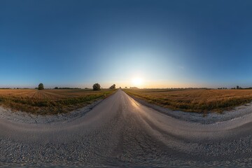 Fototapeta premium Complete 360 degree HDRI panorama of an empty asphalt road surrounded by fields at dusk under a clear sky in equirectangular format for VR AR