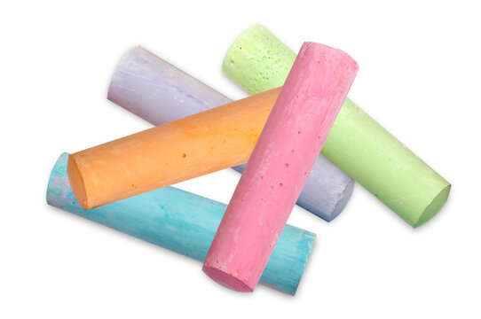 colorful chalk sticks scattered on black