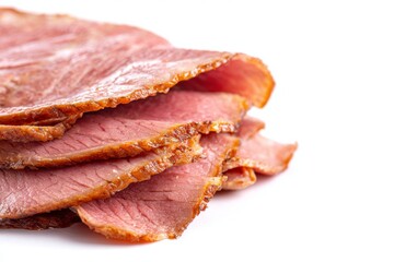 Obraz premium Slices of cooked pastrami on white background