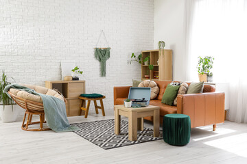 Interior of living room with record player, sofa and armchair