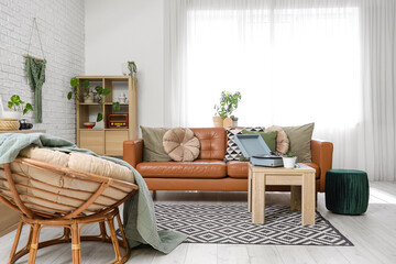 Interior of living room with record player, sofa and armchair