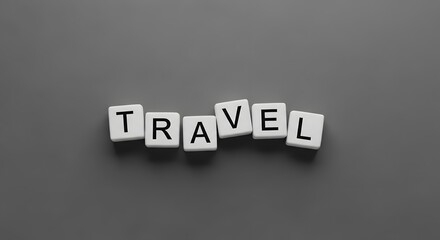 Obraz premium White letter cubes spelling out the word TRAVEL on a gray background.