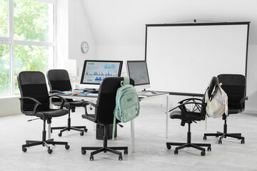 Table with computer monitors in school computer lab