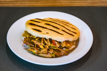 arepa stuffed with shredded meat