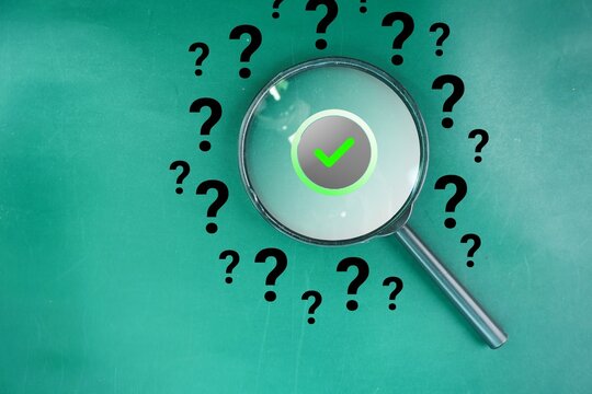 Magnifying glass and question mark signs and mark it correct or found on green background. Searching for information, data, solution or answer. FAQ, Q and A, confusion and solution. question and answe