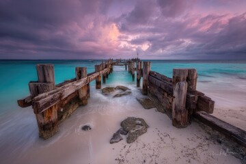 Sunrise pier, turquoise water, storm clouds