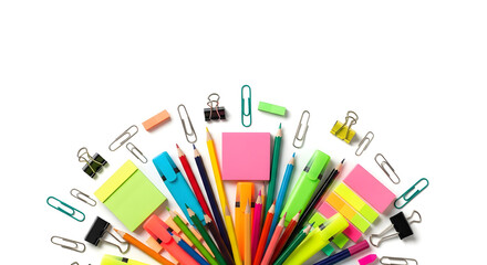 Overhead view of colorful stationery items arranged in a semi-circle on a white background, including pencils, pens, clips, and sticky notes.