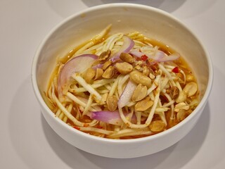 Spicy mango salad in a bowl.