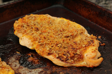 Close-Up of Cooked Chicken Cutlet Topped with Sunflower Seeds