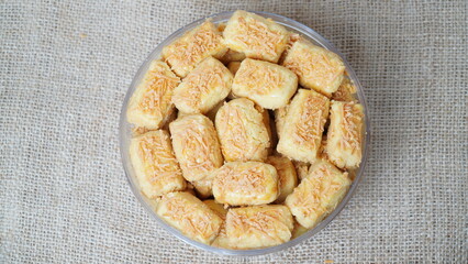 A close-up photo of traditional Indonesian cheese cookies (kastengel) 
