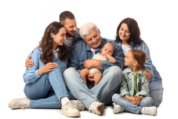 Portrait of big family in denim clothes sitting on white background