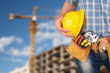 Safety workwear hold safety helmet at construction