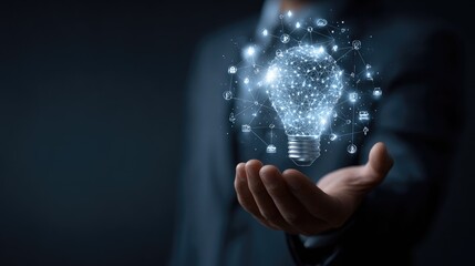 Hand holding lightbulb with digital network