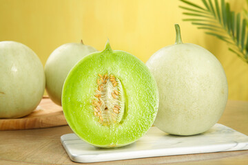 Fresh Jade Melon Shandong Variety with Green Flesh and Seeds on Marble Cutting Board