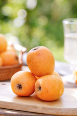 Fresh Sichuan Loquat Fruits on Wooden Table - Chinese Mountain Organic Produce Display