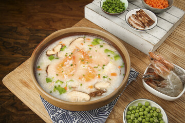 Delicious Chinese Shrimp Congee with Seafood and Vegetables Traditional Asian Rice Porridge Meal