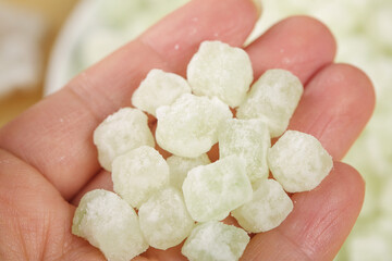 Hand Holding White Crystallized Melon Preserves Traditional Asian Candied Fruit Confectionery